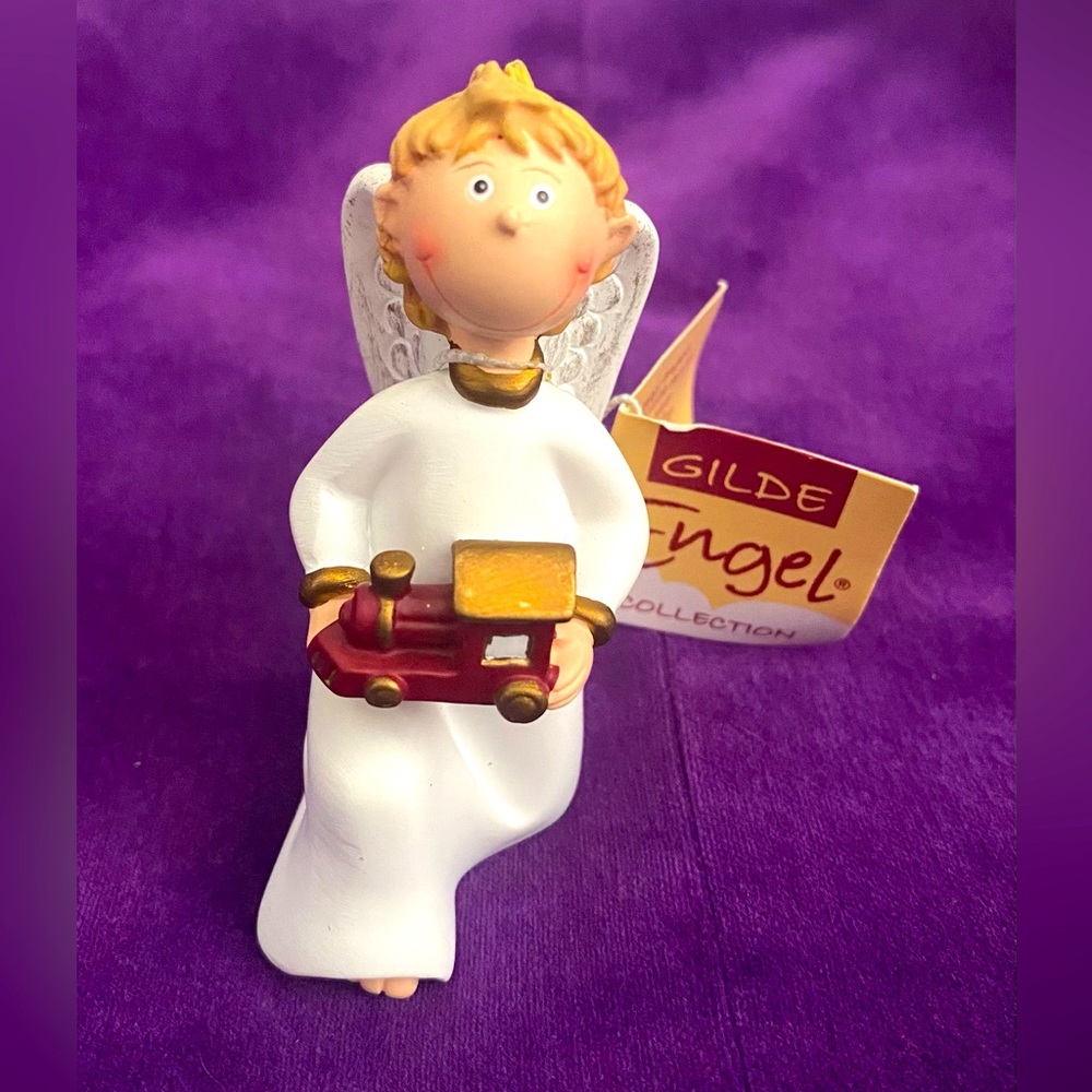 Gilde Angel Figurines and Ornaments. Item no. 28019. Kneeling boy train.